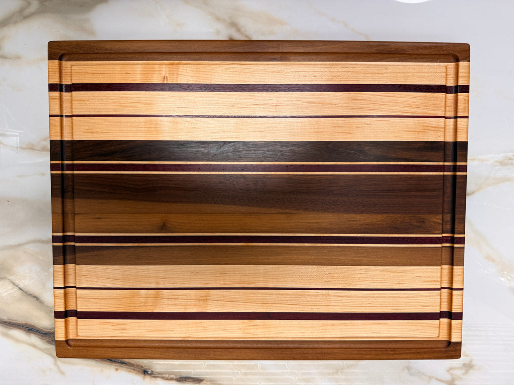 Heirloom Elite Cutting Board — Edge Grain Walnut, Maple & Purpleheart (16” × 22”)