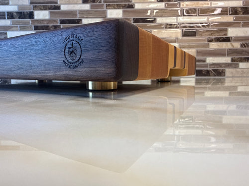 Heritage Cutting Board 18” × 12” × 1.5” — Maple, Walnut, Cherry & Purple Heart | Juice Groove + Hand Holds with brass feet