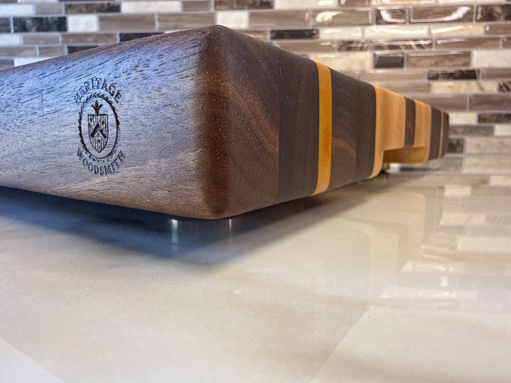 Heritage Cutting Board 18” × 12” × 1.5” — Maple, Walnut, & Yellow Heart | Juice Groove + Hand Holds with brass feet