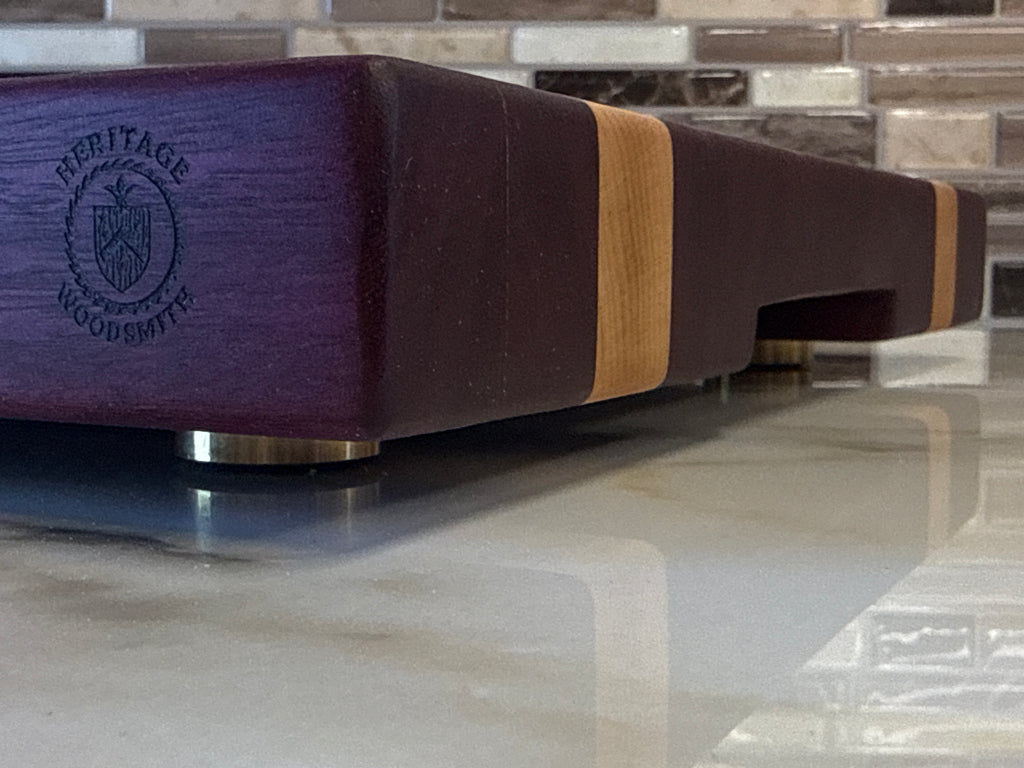 Heritage Cutting Board 18” × 12” × 1.5” — Purple Heart & Makple| Juice Groove + Hand Holds and Brass feet.