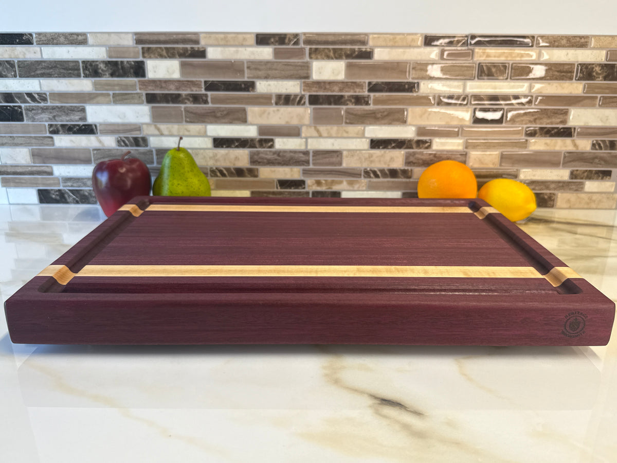 Heritage Cutting Board 18” × 12” × 1.5” — Purple Heart & Makple| Juice Groove + Hand Holds and Brass feet.